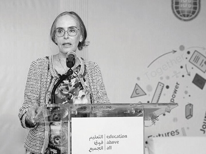 Doctor Mary speaking at podium