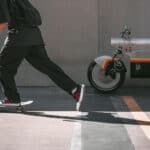 katalis electric bike in street with skateboard