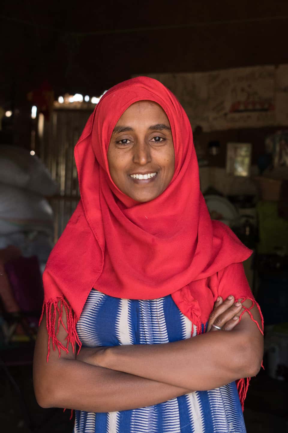 Birtukan Gebeyehu wearing red head scarf smiling