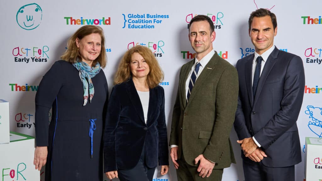 A group of people standing next to each other at an event.