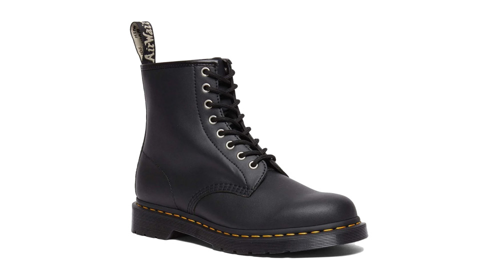 A black leather lace-up boot with a thick sole and yellow stitching around the base. The boot has a pull tab at the back with a distinct pattern, almost like it's from a catalog of timeless styles. Mid-calf length and sturdy, it is commonly known for its durable construction and classic aesthetic.